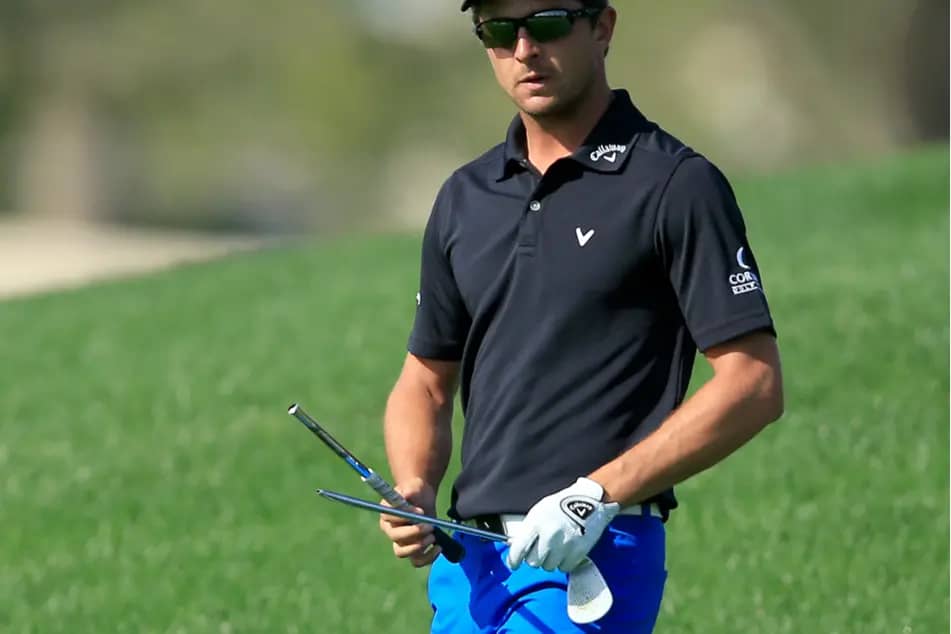 a golfer with broken sand wedge